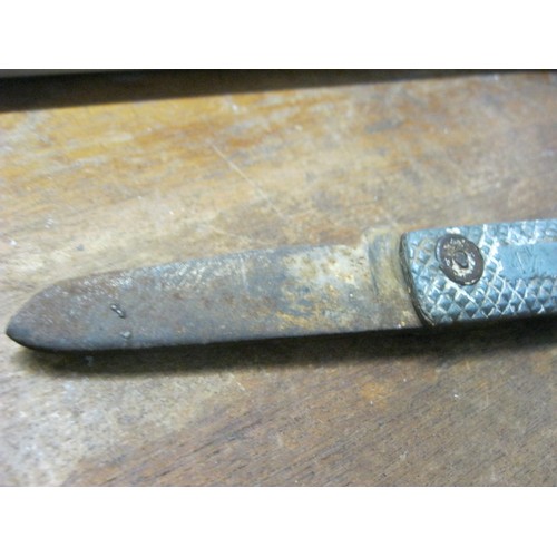 302 - A military clasp knife, one handle stamped 'F/O Waite', well worn and used but in solid condition