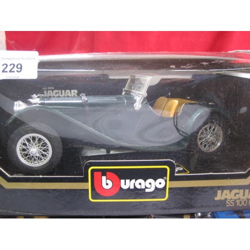 229 - Three Burago 1/18 scale die cast model cars - 3026 Jaguar E Cabriolet (1961); 3006 Jaguar SS 100 (19... 