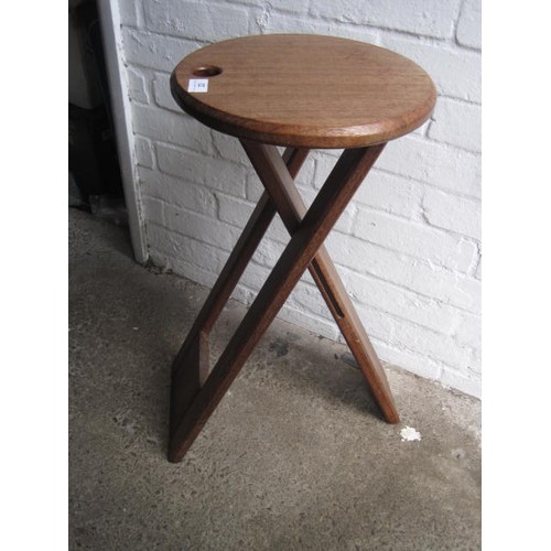 22 - A Roger Tallon for Sentou of France circular-seated teak-framed folding stool, brass hinges, height ... 