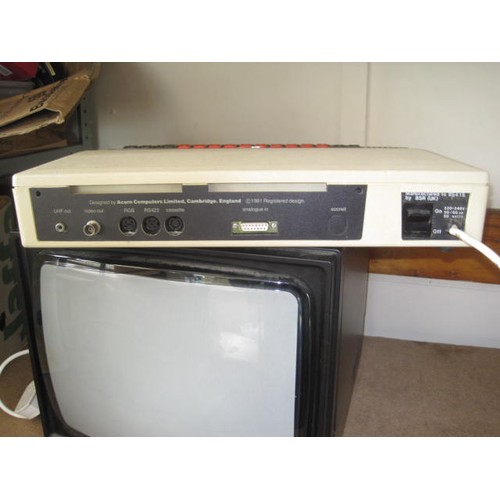 233 - Acorn BBC Microcomputer with monitor and other hardware. This lot comprises -
British Broadcasting C... 