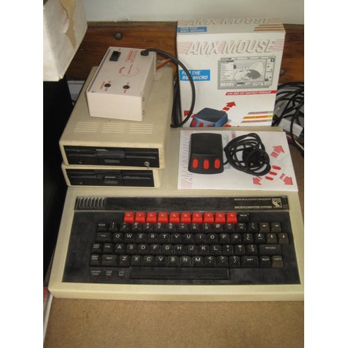 233 - Acorn BBC Microcomputer with monitor and other hardware. This lot comprises -
British Broadcasting C... 