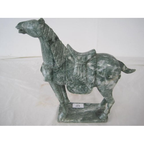 127 - A carved green stone model of a horse in the Chinese archaistic style, the marbled stone to resemble... 