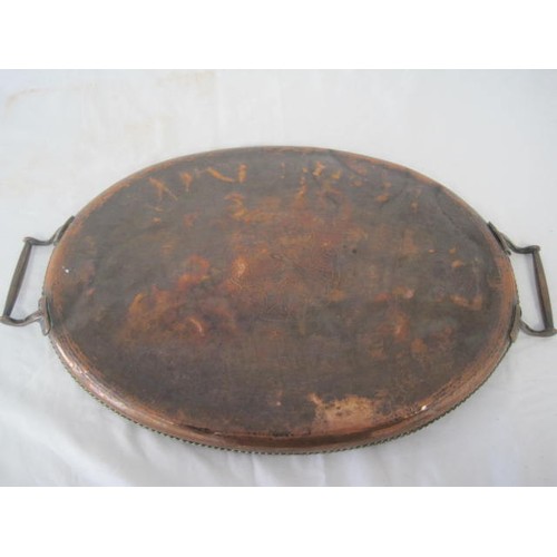 119 - A Hugh Wallis Arts and Crafts oval copper tray - A/F, the tray is in a considerably dented and uneve... 