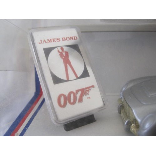 137 - Corgi James Bond Aston Martin 94060 in original box. The vehicle has apparently never been removed f... 