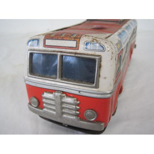 218 - A vintage Modern Toys Japanese made 1960s tin plate Sound Bus, rather battered but intact, battery p... 