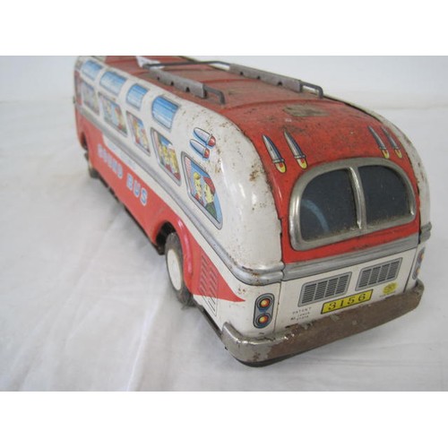 218 - A vintage Modern Toys Japanese made 1960s tin plate Sound Bus, rather battered but intact, battery p... 