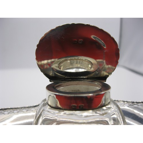 75 - A solid silver Desk Inkwell set on four glass feet, with glass & silver lidded pot, hallmarked Birmi... 