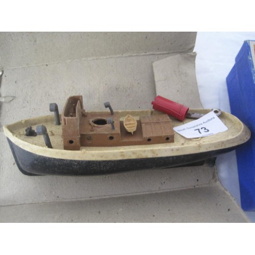 73 - TSL fully boxed wooden rocking horse along with a Penguin Clockwork Tugboat with box and key but mis... 