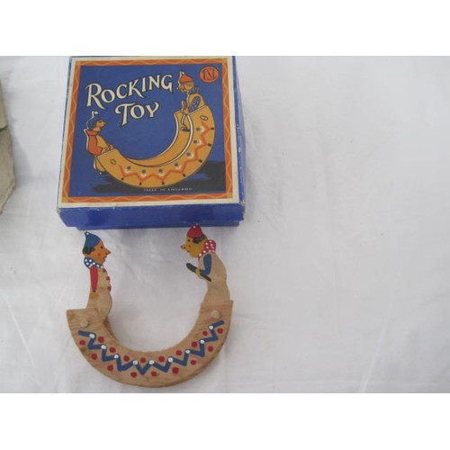 73 - TSL fully boxed wooden rocking horse along with a Penguin Clockwork Tugboat with box and key but mis... 