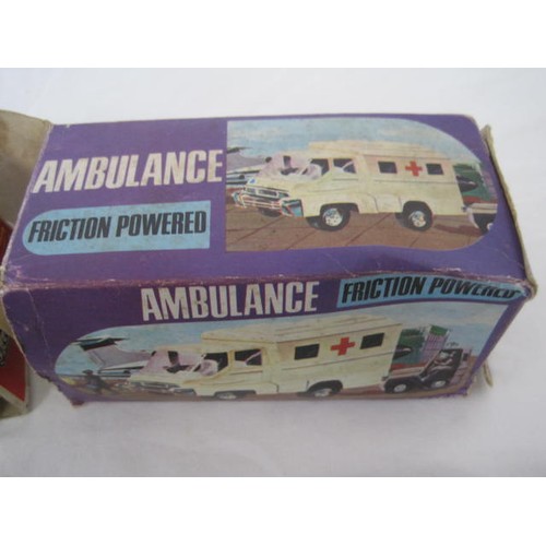 134 - A boxed Woolbro Friction Powered Ambulance, a boxed yone Disc Firing Tank, a boxed Mabuchi S-1 Subma... 