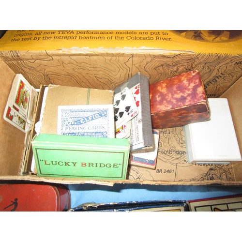 241 - A selection of vintage cards and card games including a dice shaker and various boards .Also in this... 