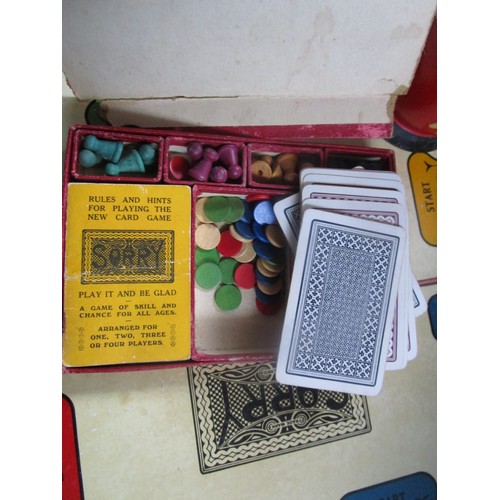 241 - A selection of vintage cards and card games including a dice shaker and various boards .Also in this... 