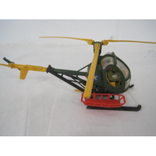 283 - A vintage Britains Bell helicopter with figures inside and winch to underside, in good order