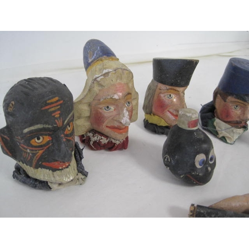 295 - A selection of wooden heads from Punch & Judy puppets, plus assorted arms and legs in wood for the s... 