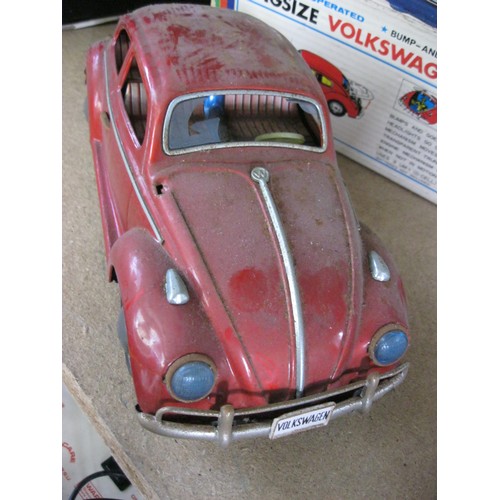 125 - A 1960s tin plate Bandai Kingsize Volkswagen Sedan, battery operated, with original box. Box rather ... 