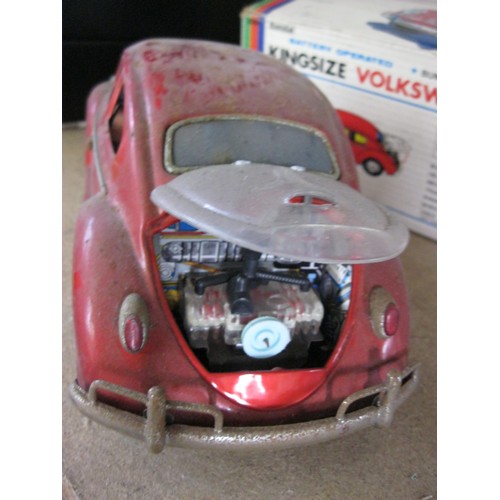 125 - A 1960s tin plate Bandai Kingsize Volkswagen Sedan, battery operated, with original box. Box rather ... 