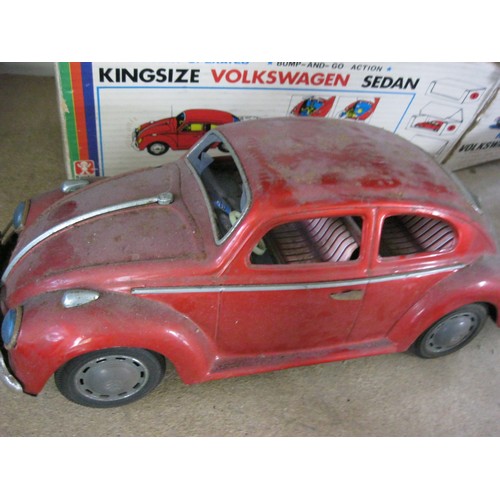 125 - A 1960s tin plate Bandai Kingsize Volkswagen Sedan, battery operated, with original box. Box rather ... 