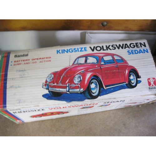 125 - A 1960s tin plate Bandai Kingsize Volkswagen Sedan, battery operated, with original box. Box rather ... 