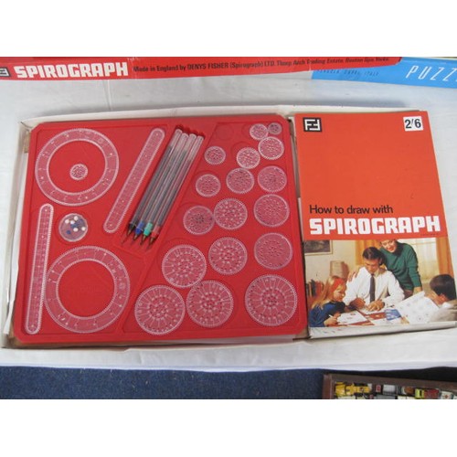 264 - A box of jigsaw puzzles plus a vintage Spirograph, boxed