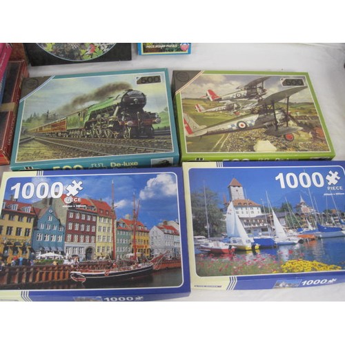 261 - A large box of vintage jigsaw puzzles, some sealed