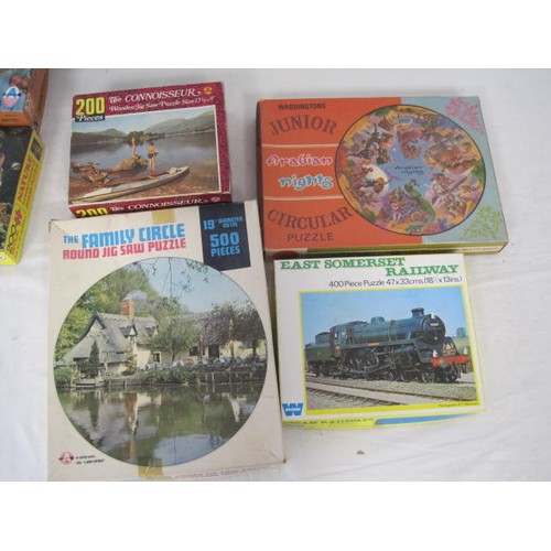 263 - A large box of vintage jigsaw puzzles, some sealed