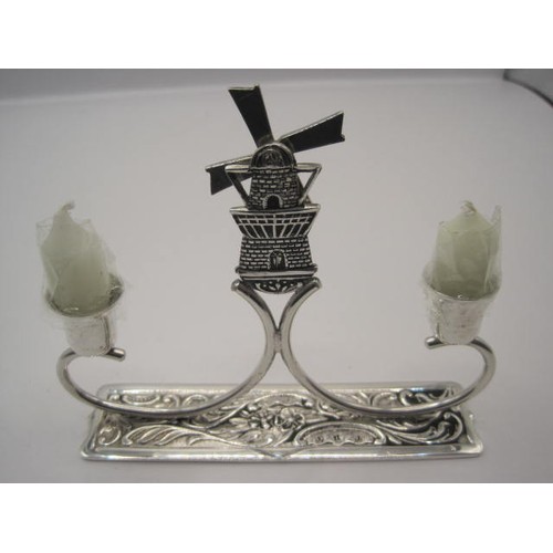 175 - A small .900 silver Dutch-made candlestick featuring two small candles holders, one on either side o... 