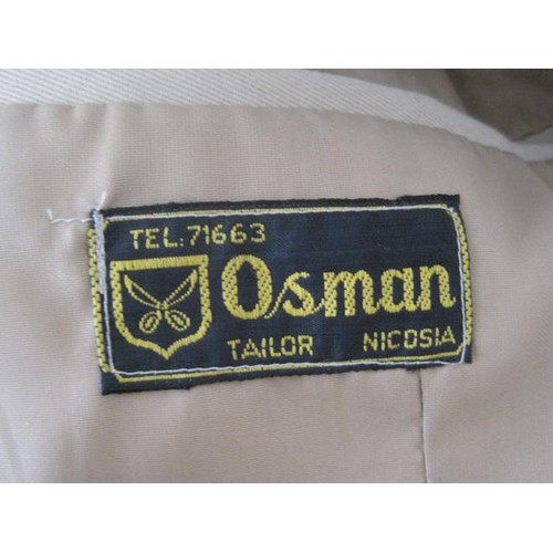 87 - A pair of British officer's uniforms, one in tropical khaki, the other a white mess jacket, both wit... 