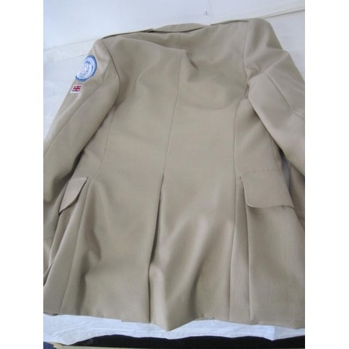 87 - A pair of British officer's uniforms, one in tropical khaki, the other a white mess jacket, both wit... 