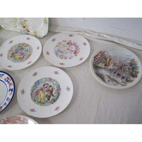 56 - About twelve decorative plates (including Poole and Royal Doulton valentine), a Crown Devon trinket ... 