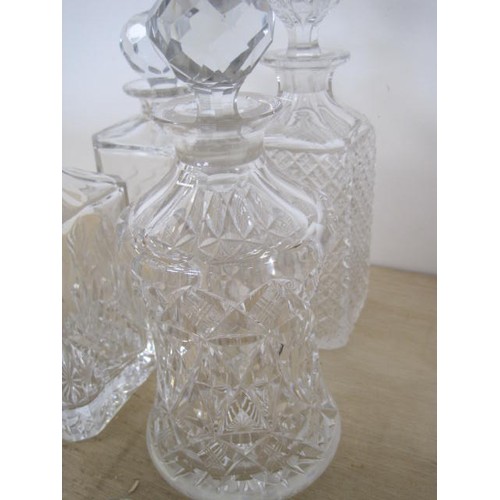 165 - Five decanters - a Waterford slice cut decanter with spire stopper, 33cm, very good; Edinburgh Cryst... 