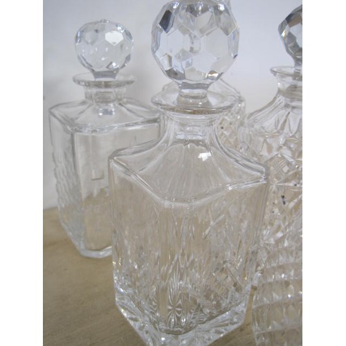 165 - Five decanters - a Waterford slice cut decanter with spire stopper, 33cm, very good; Edinburgh Cryst... 