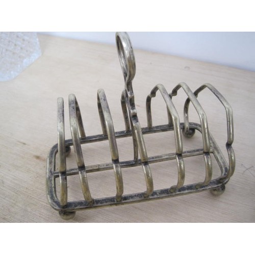 169 - A hardwood decanter tray with brass gallery; an electroplated six-division toast rack (a/f, bent); s... 