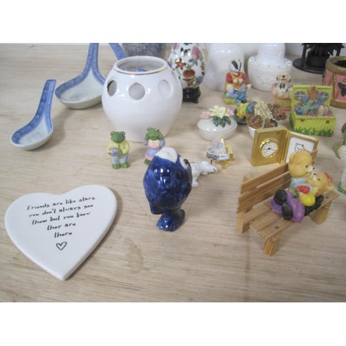 159 - A mixed lot of decorative china and resin ornaments, including animal figures, essential oil burners... 