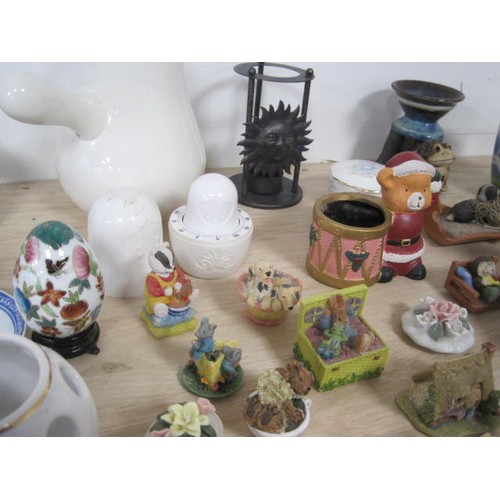 159 - A mixed lot of decorative china and resin ornaments, including animal figures, essential oil burners... 