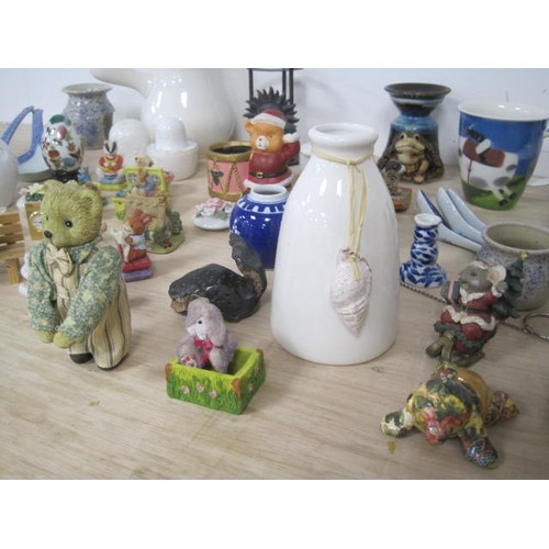 159 - A mixed lot of decorative china and resin ornaments, including animal figures, essential oil burners... 