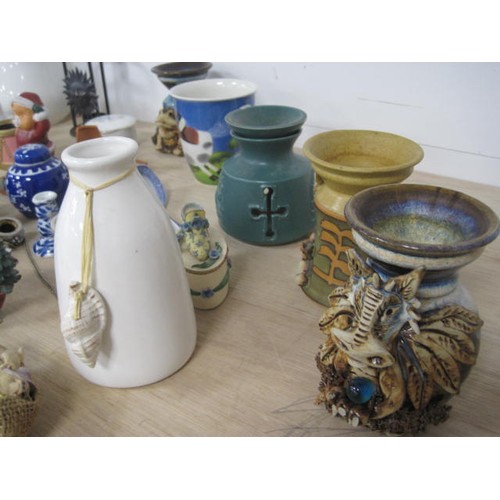 159 - A mixed lot of decorative china and resin ornaments, including animal figures, essential oil burners... 