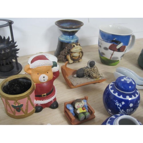 159 - A mixed lot of decorative china and resin ornaments, including animal figures, essential oil burners... 