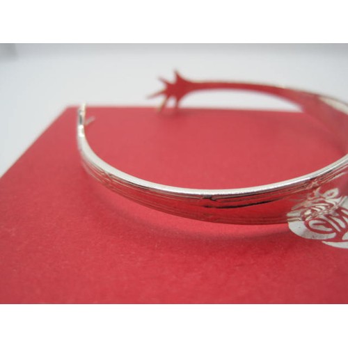 214 - A boxed Silver sugar tongs bracelet, hallmarked for Birmingham 1933