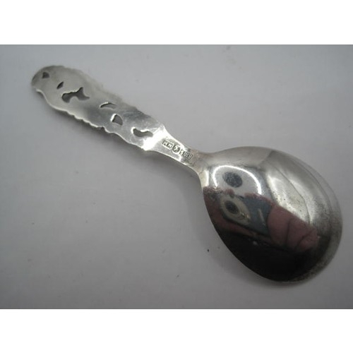 192 - An .830 Silver Caddy Spoon with pierced floreat decor to handle and continental hallmarks to reverse... 