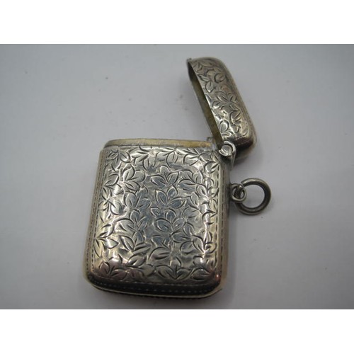 202 - A sterling silver Vesta Case, inscribed W D to front, with floral engraved decor, hallmarked for Bir... 