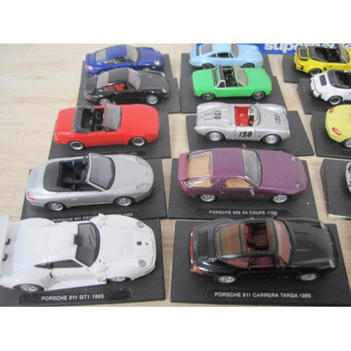 298 - A collection of twenty-one DeAgostini models of Porsche cars, including 550 RS Spyder 1955, 911 RS C... 