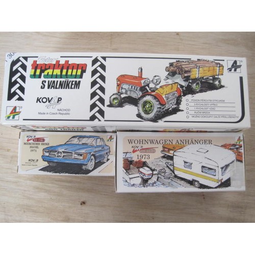 306 - Three Kovap tin plate vehicles with original boxes - clockwork tractor and trailer, retro 1973 carav... 