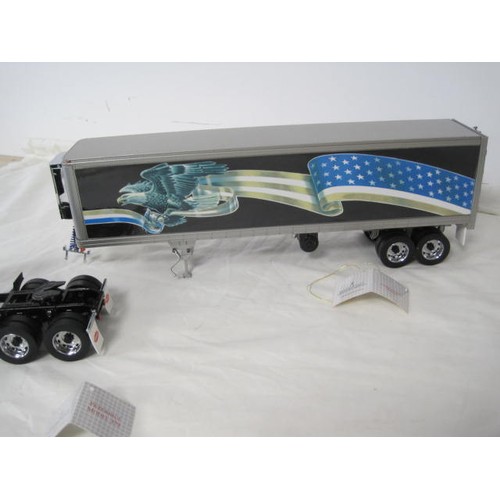 310 - Franklin Mint Precision Models Peterbilt model 379 tractor and refrigerated trailer. With labels, ve... 