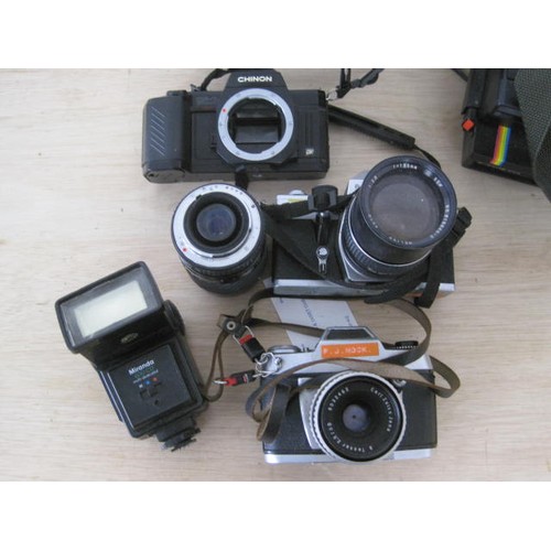 71 - A box of assorted vintage cameras including Polaroid