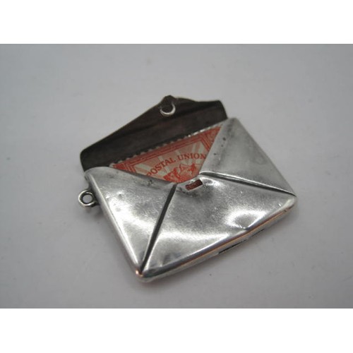 41 - Silver envelope-shaped stamp case, with suspension loop to be worn as a locket, stamped within STERL... 