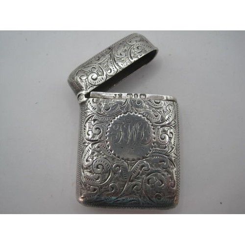 48 - Silver vesta with foliate chasing and engraved initials FWL, marks for Birmingham, 1893, maker's sta... 