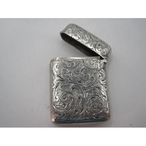 48 - Silver vesta with foliate chasing and engraved initials FWL, marks for Birmingham, 1893, maker's sta... 