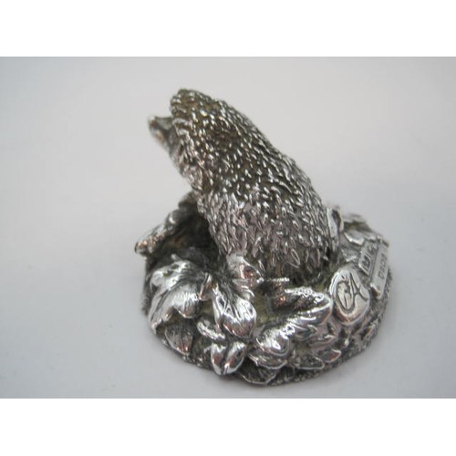 53 - Country Artists silver model of a hedgehog on a mound of leaves on a round filled base, height 2.7cm... 