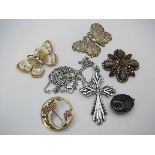 69 - An agate pendant mounted as a locket, a base metal cross pendant on chain, and four costume brooches