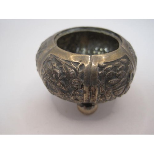 21 - Chinese white metal small bowl on three ball feet, repousse and engraved decoration of figures and f... 